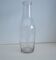 Large antique bottle made of blown glass