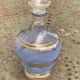 Blue granite glass carafe with vintage gold trim.
