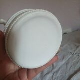 Small round box topped with a vintage biscuit porcelain angel