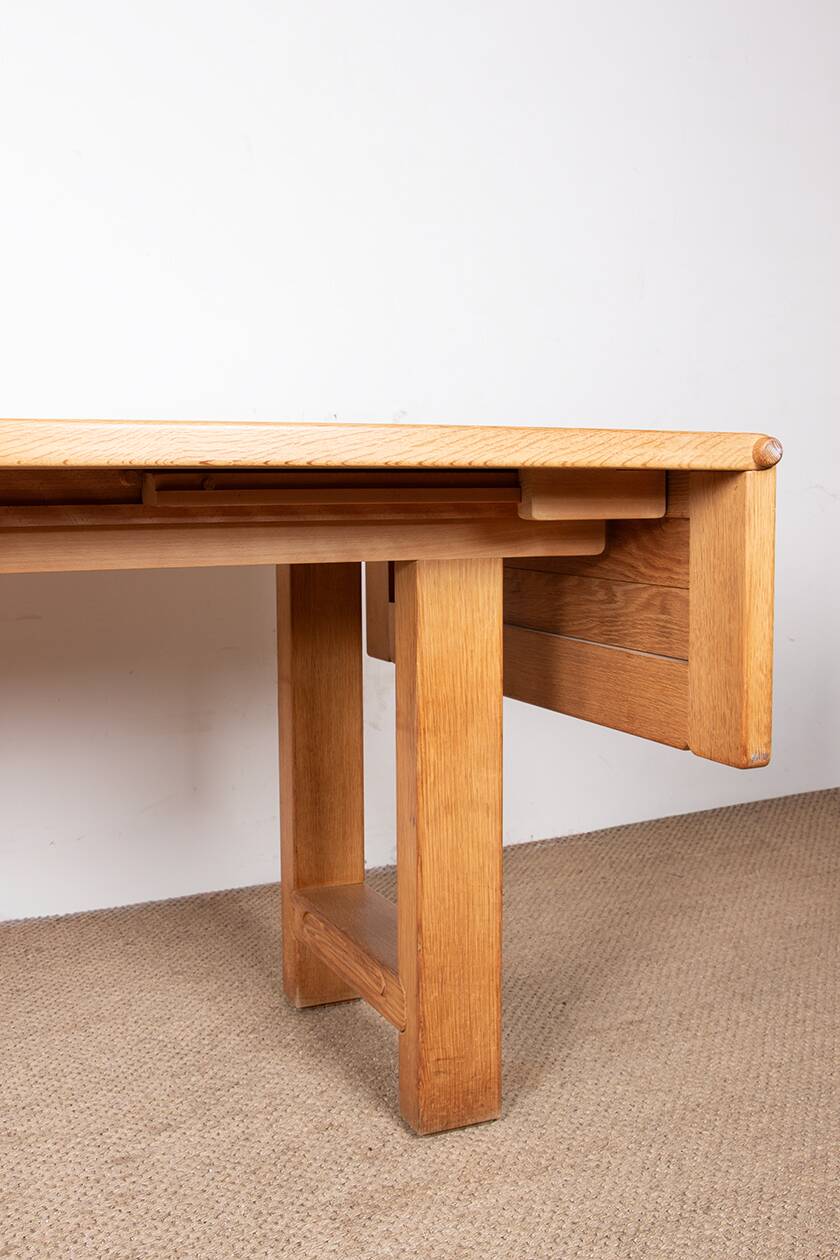 Large extendable dining table in solid oak by Guillerme and Chambron.