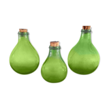 3 green glass bottles