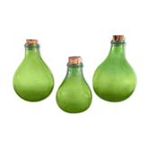 3 green glass bottles