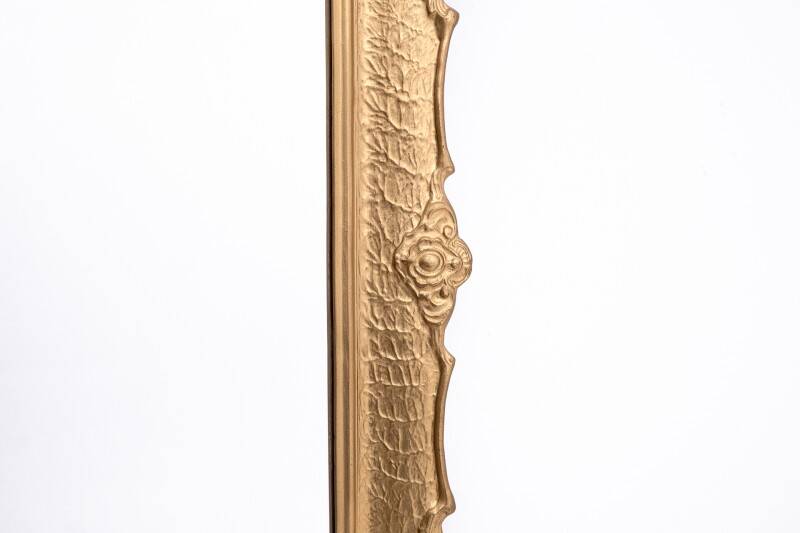 Mirror in a decorative gold frame