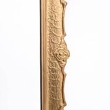 Mirror in a decorative gold frame