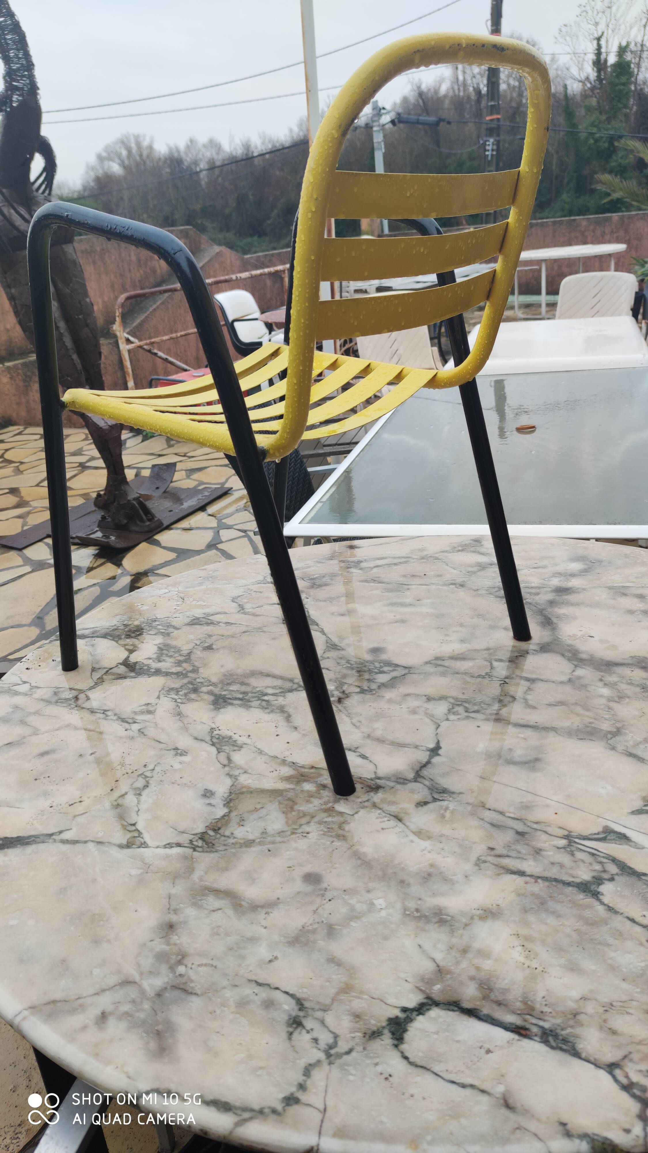 Armchair in black and yellow painted steel, circa 1950, in the style of Mallet-Stevens