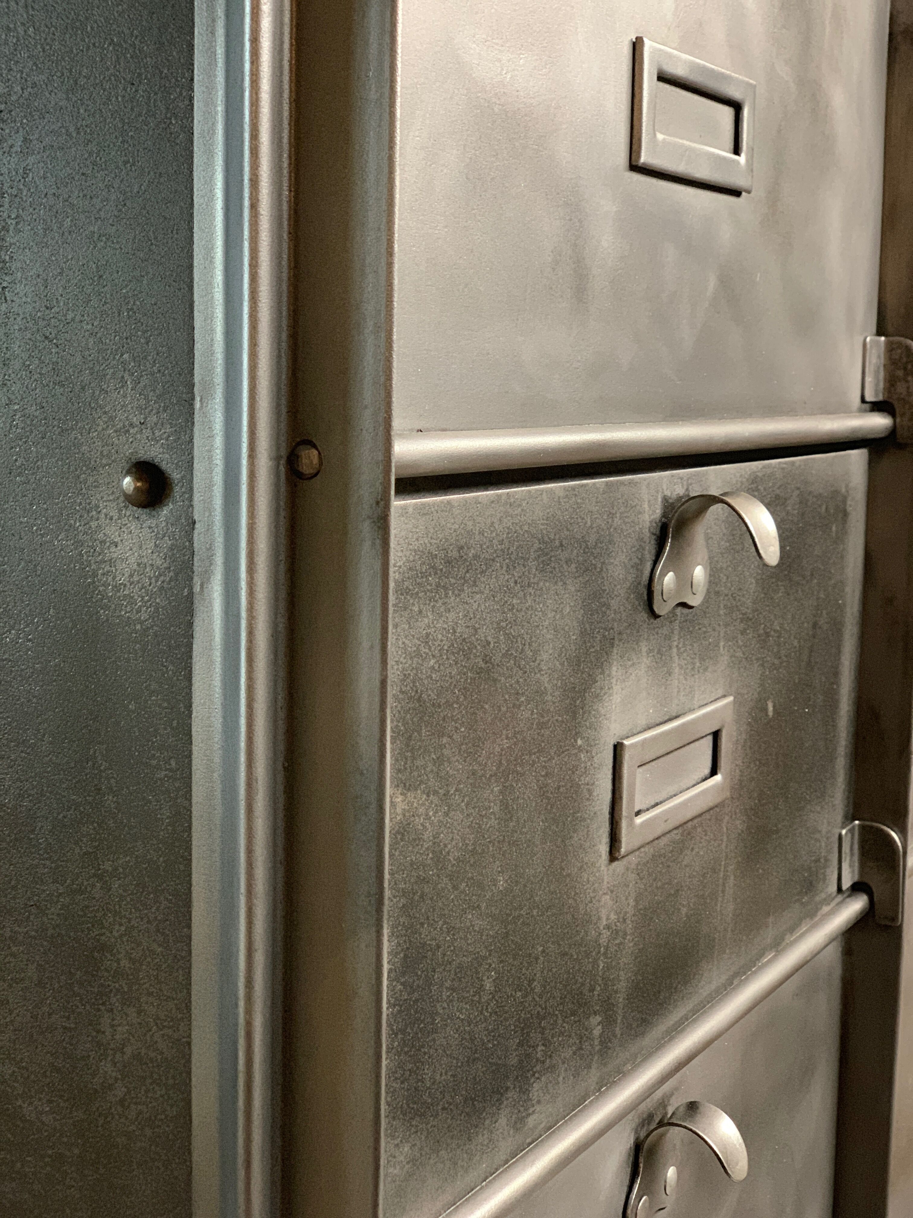 Industrial cladding furniture in brushed and patinated steel