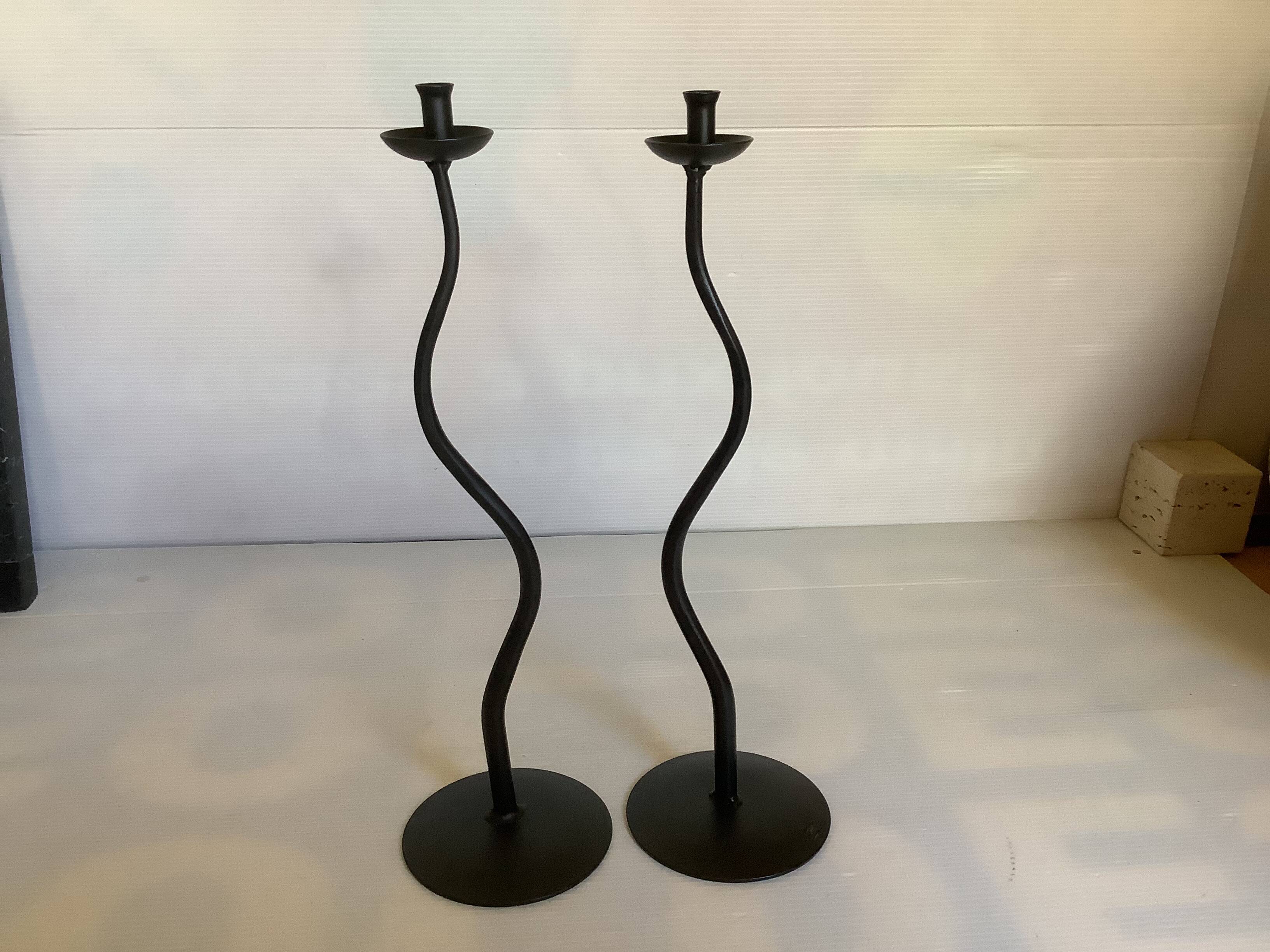 Pair of black hysteria-style candlesticks