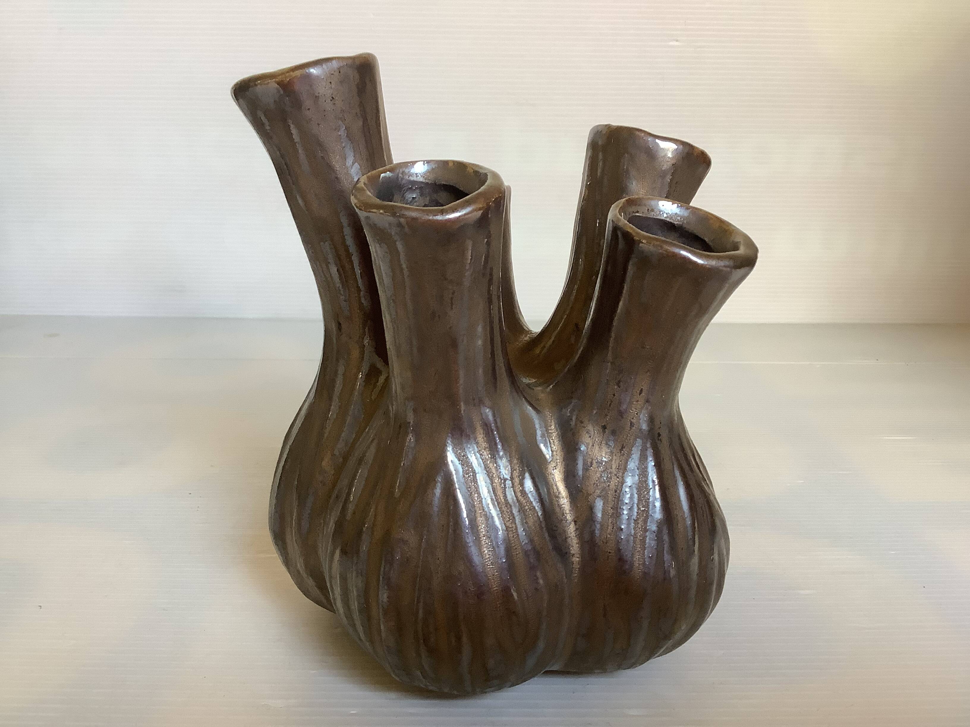 Tulip vase with ceramic flowers in brown and gold.