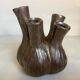 Tulip vase with ceramic flowers in brown and gold.
