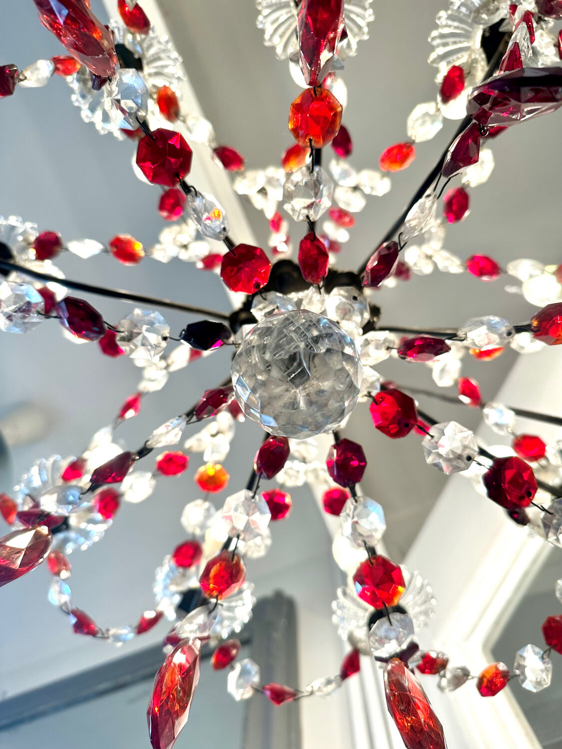 Antique chandelier with red crystal pendants, 9 lights.