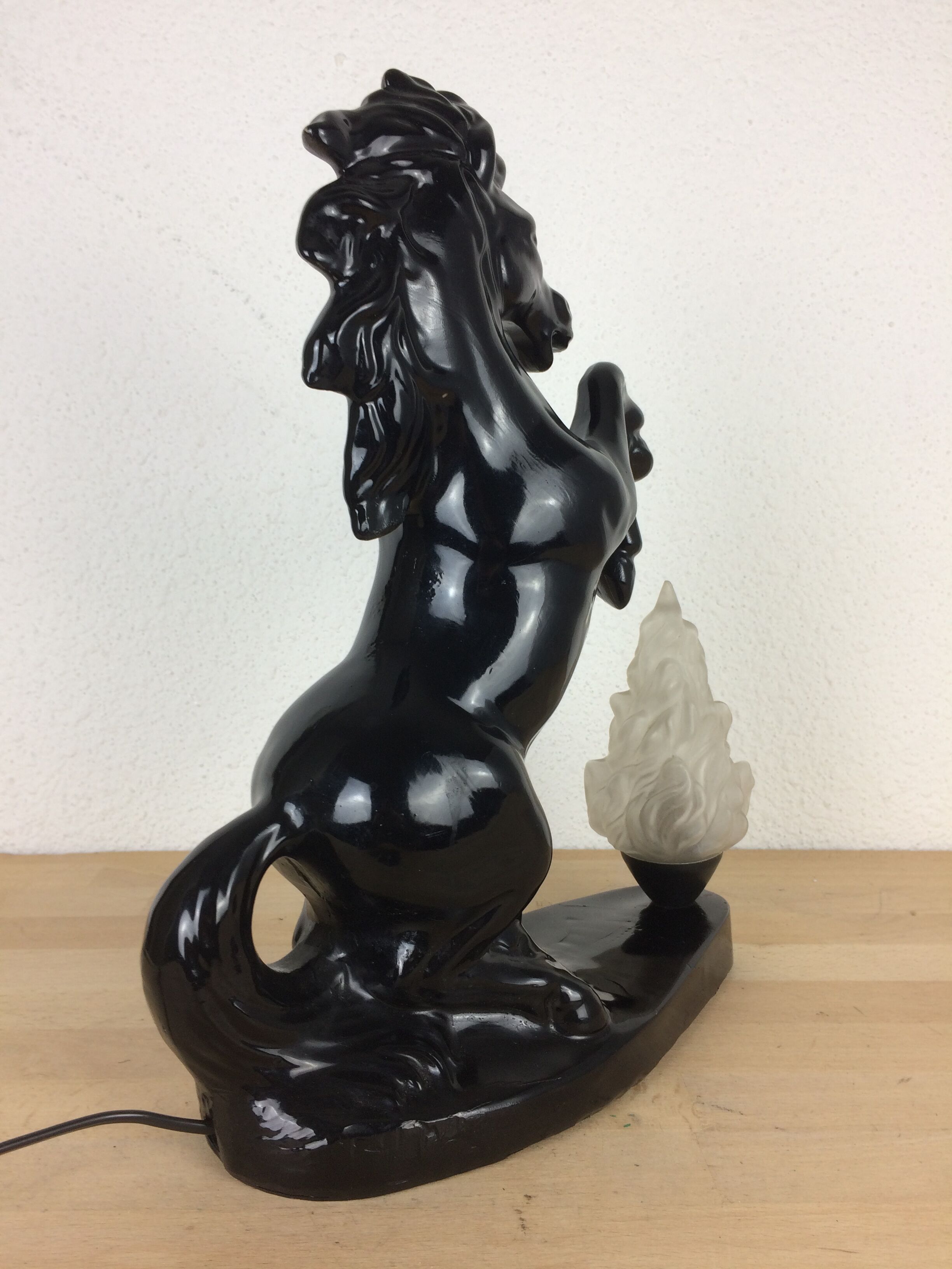Prancing horse lamp and flame