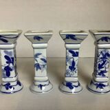 Four candlesticks with blue patterns