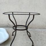 Antique bidet in enamelled sheet metal with wrought iron support