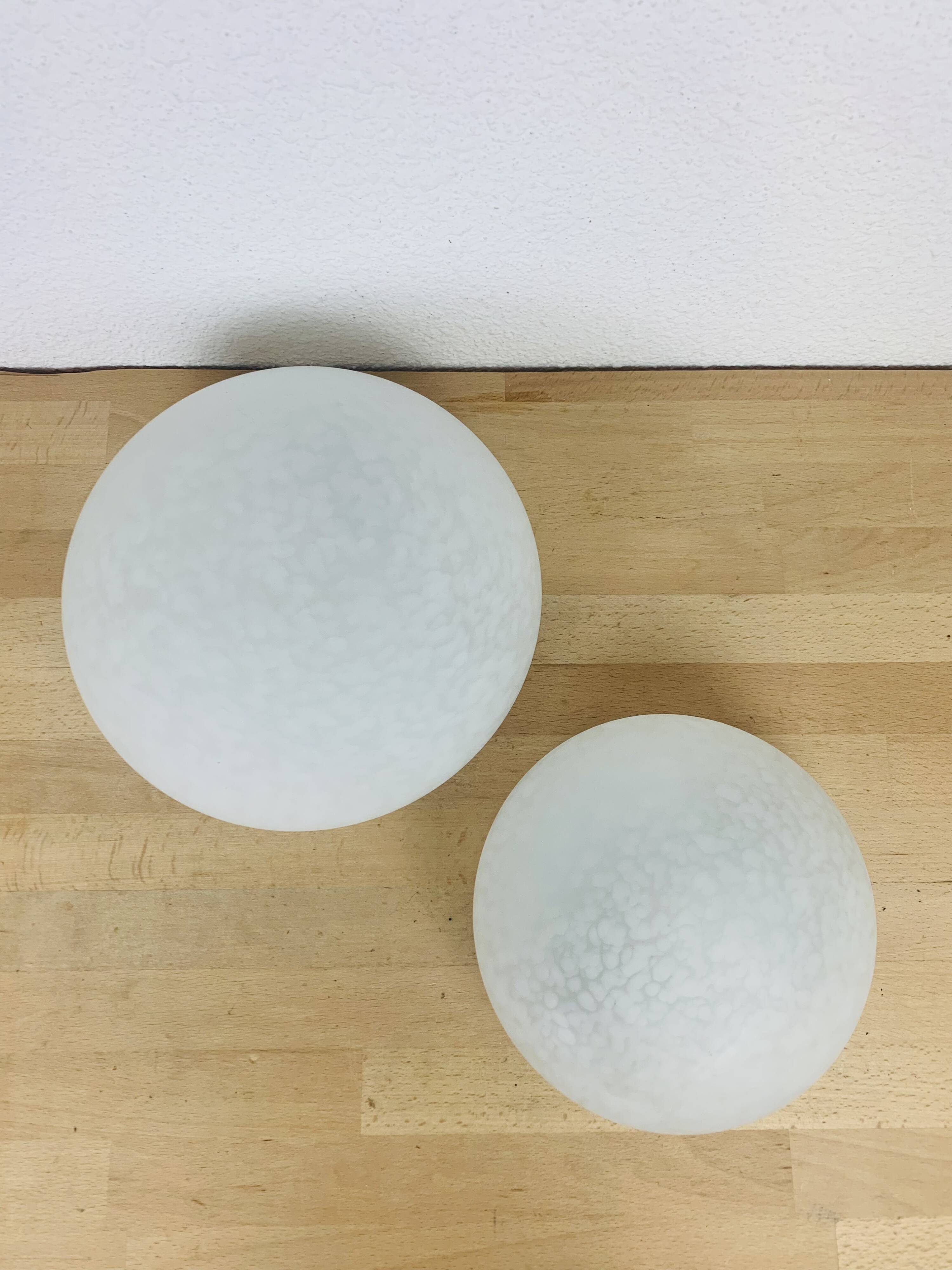 Pair of speckled glass ball wall lights from Vianne, half sphere