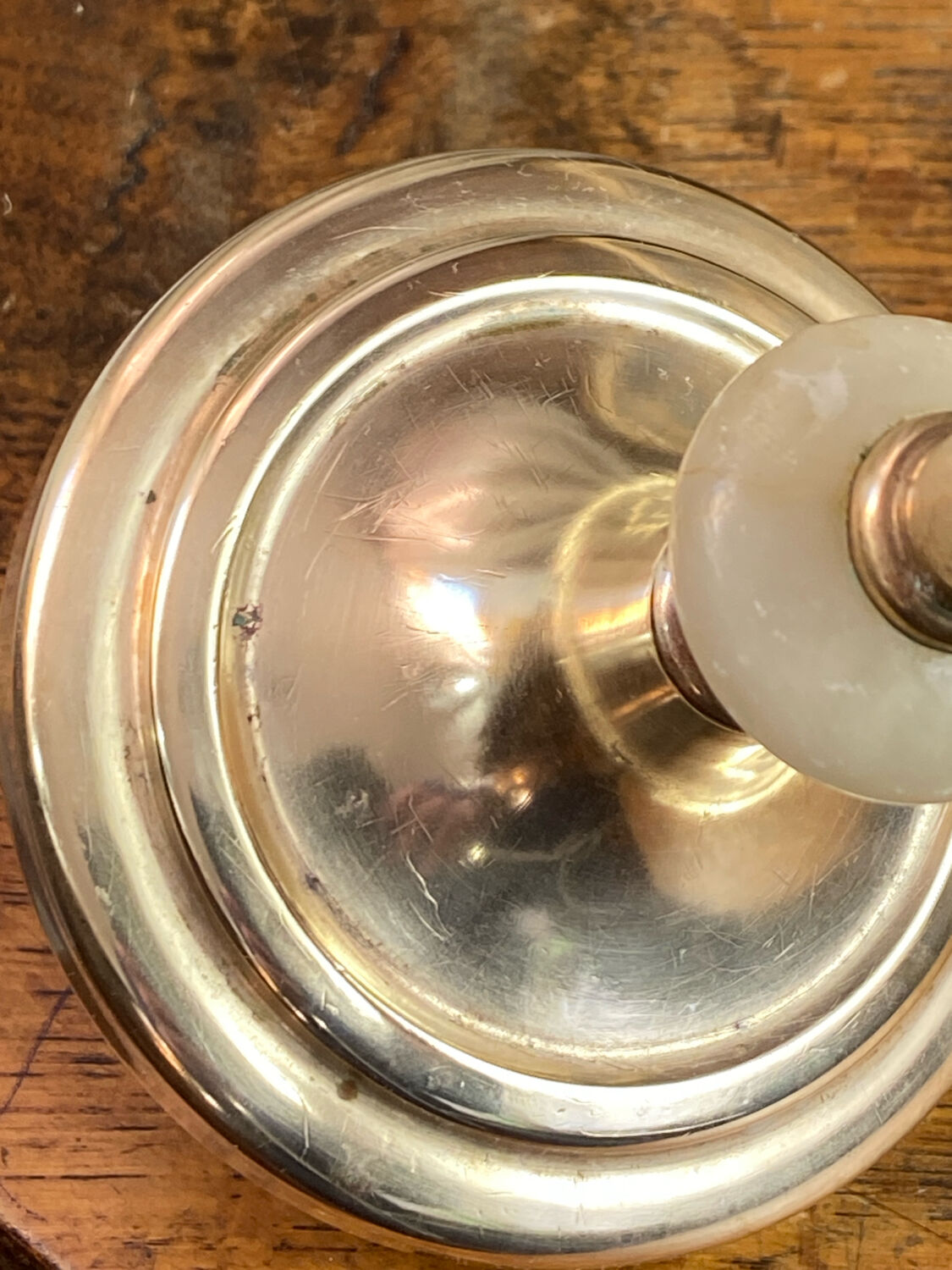 Pair of brass and stone candlesticks