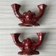 Pair of 1950s burgundy earthenware candlesticks