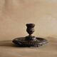 Bronze cellar rat hand candle holder