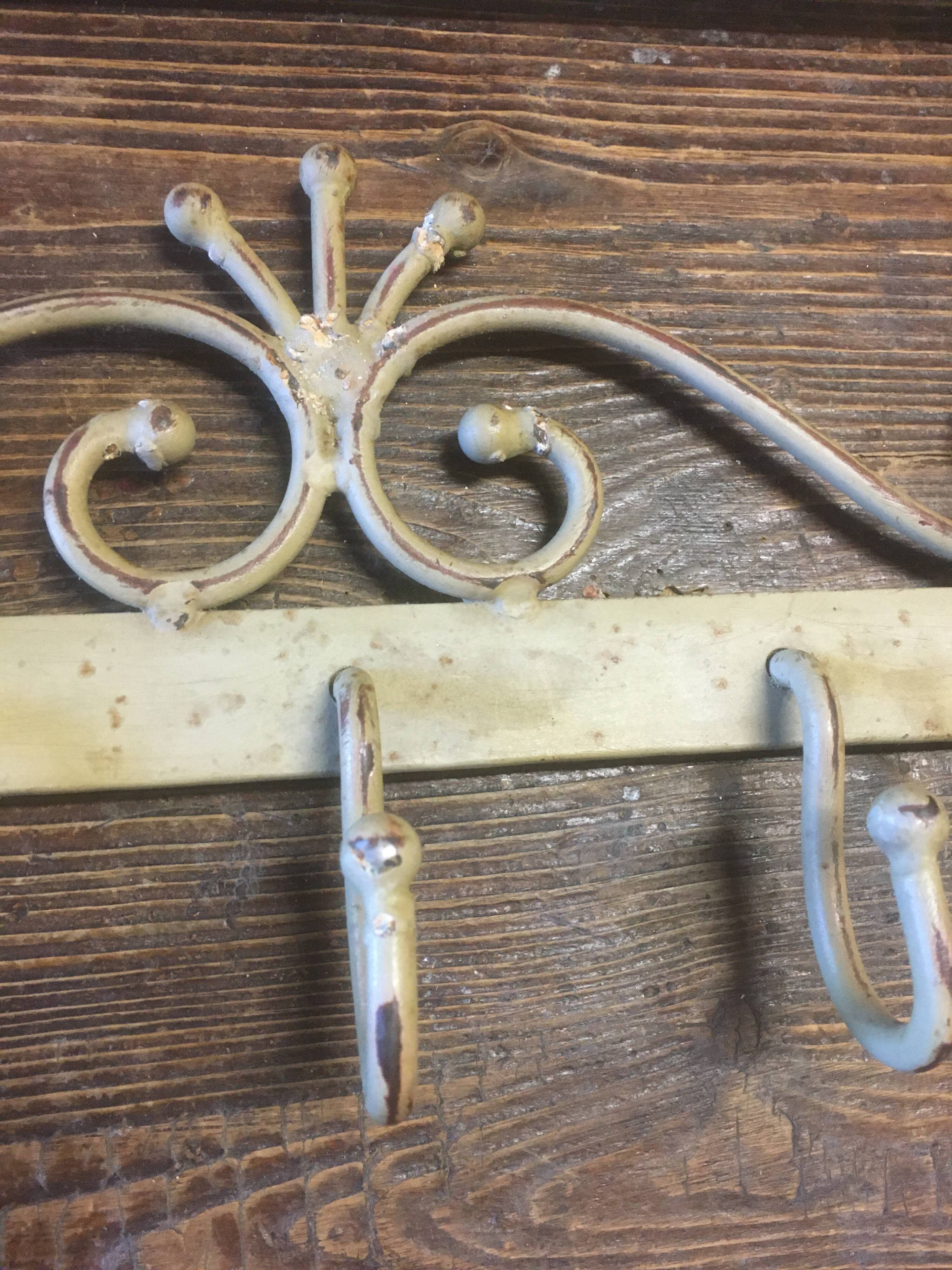 White wrought iron coat and hat rack
