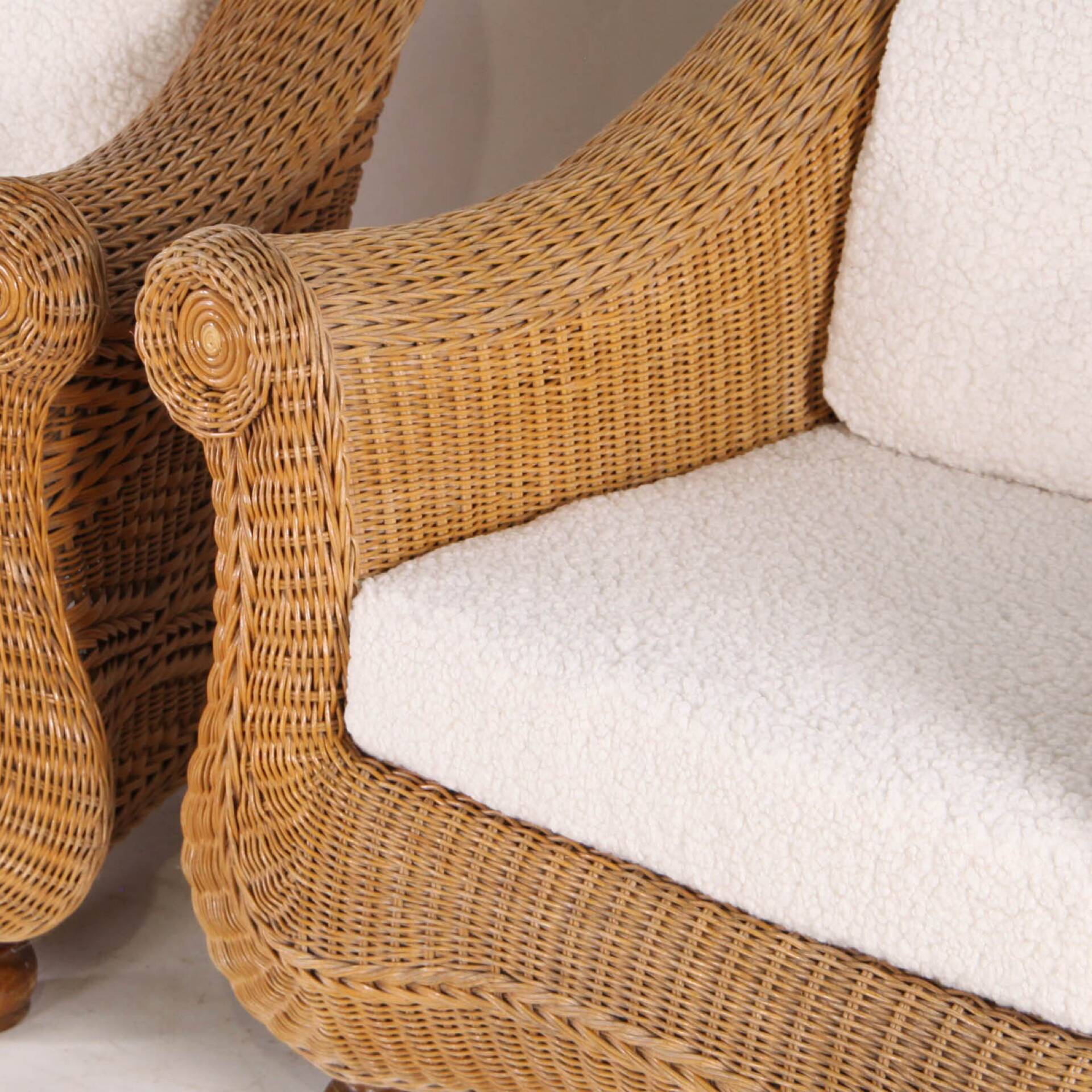 Pair of woven wicker armchairs