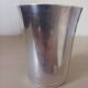 Silver-plated metal tumbler.