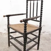 Black bobbin chair with armrests and rush seat – ca. 1900-1930
