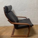 Leather armchair with footrest