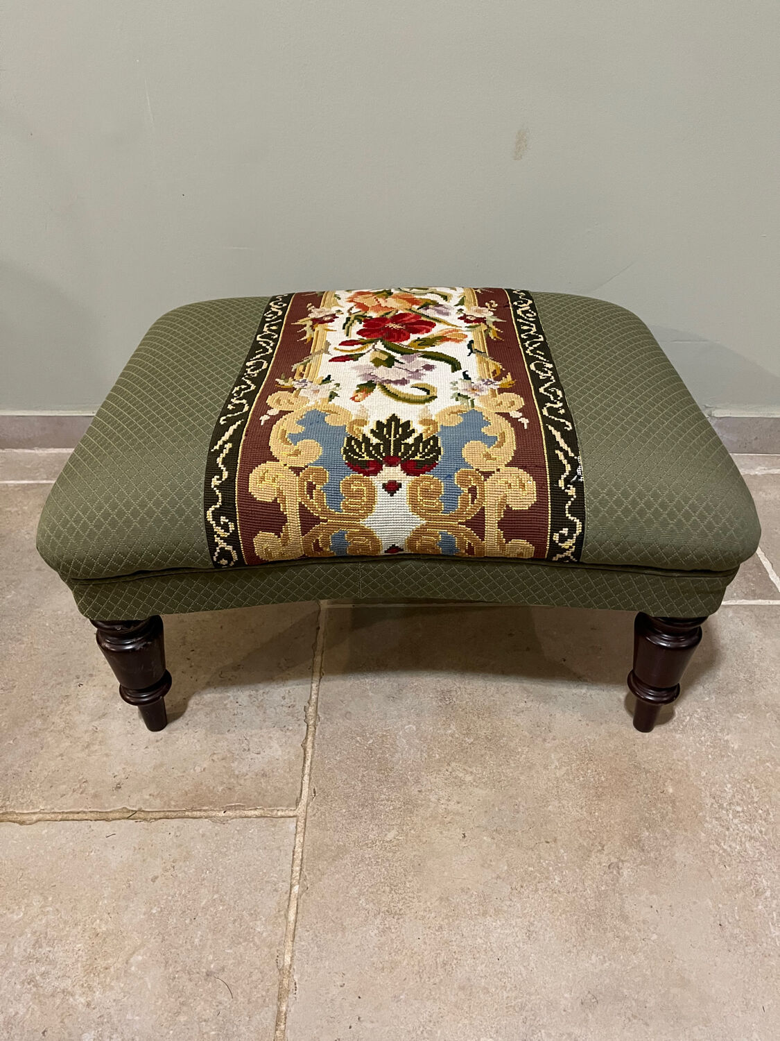 Vintage upholstered footstool, floral decor in Aubusson style.