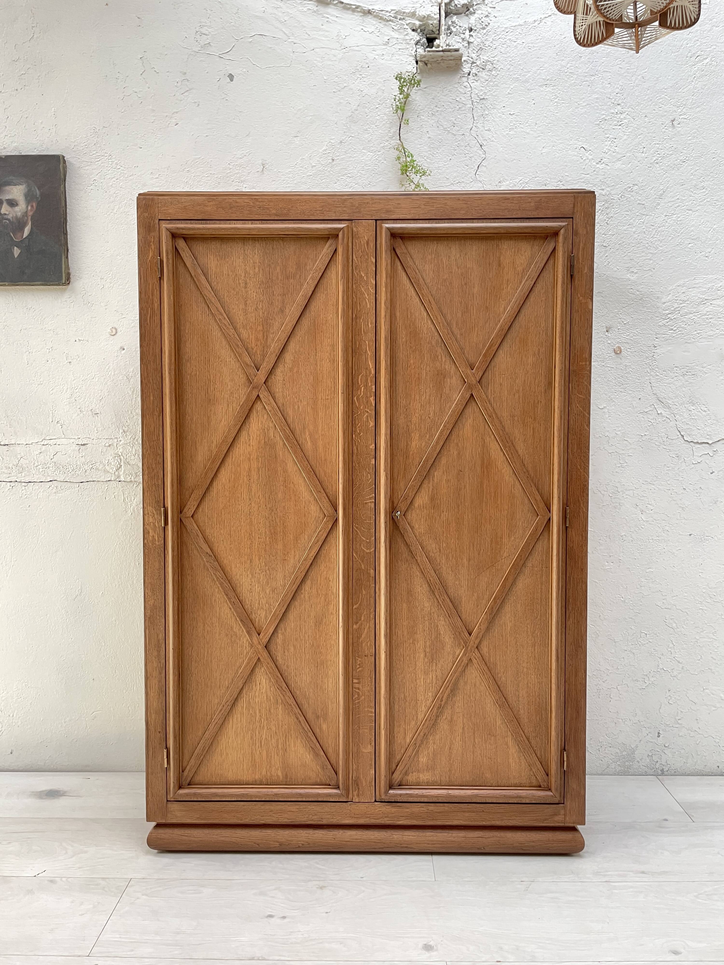 Storage unit in solid oak and veneer, circa 1960.