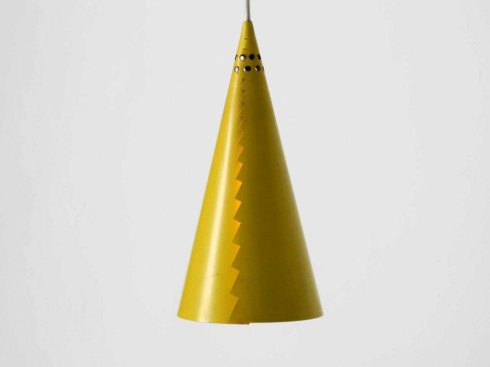 Rare Mid Century Modern cone shaped pendant lamp made of sheet steel in yel
