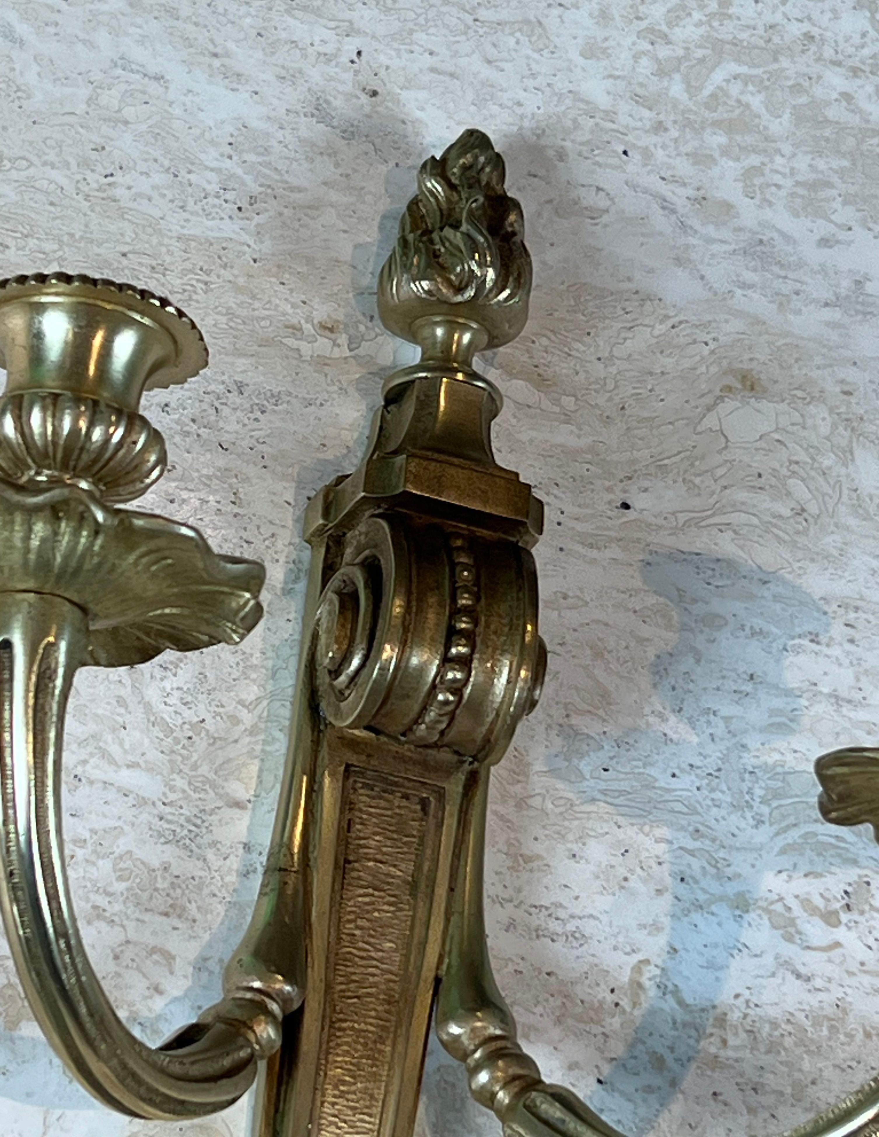 Pair of Louis XVI style bronze wall sconces