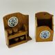 Wall-mounted egg cup holder and wooden utensil holder.