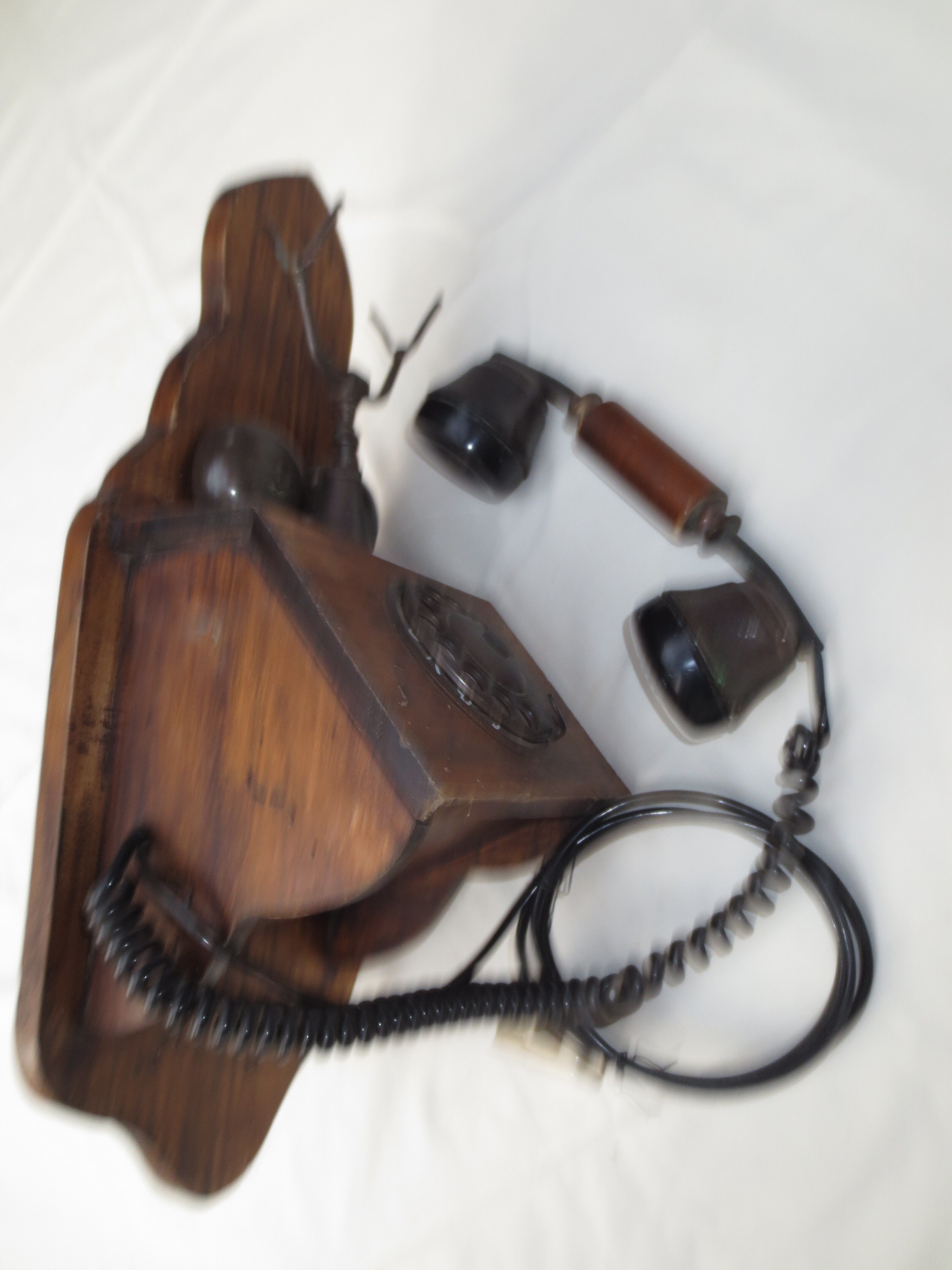 Old wood and metal wall phone
