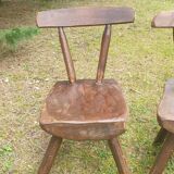 Four chairs and brutalist coffee table