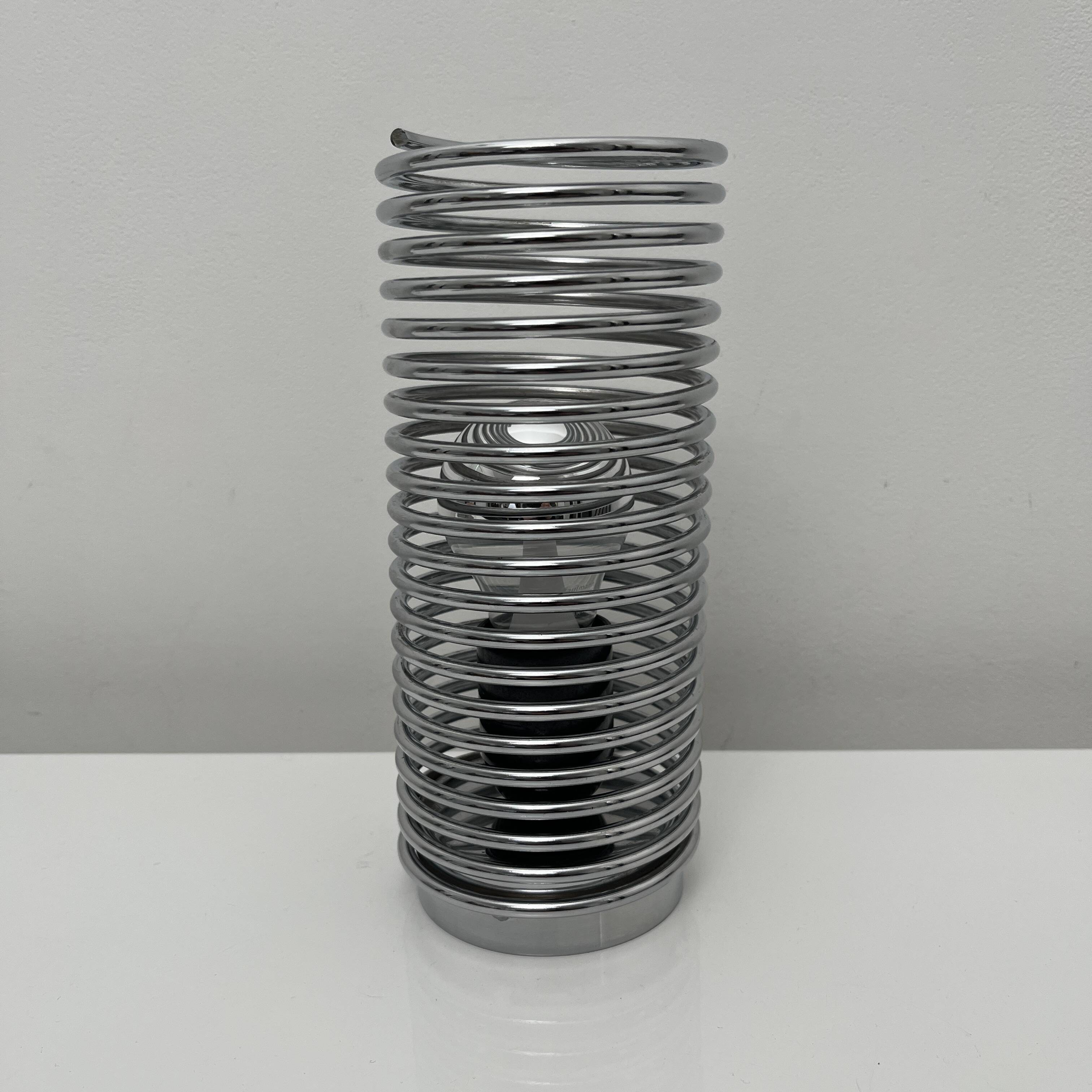 Massive chrome spring lamp