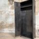 Industrial locker room in raw metal, circa 1930.