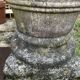 Large Cretan jar in terracotta with three handles on a stone base.