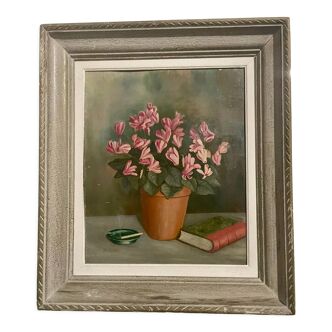 1940s French oil painting on board Still Life with pot of pink cyclamens, book and ashtray