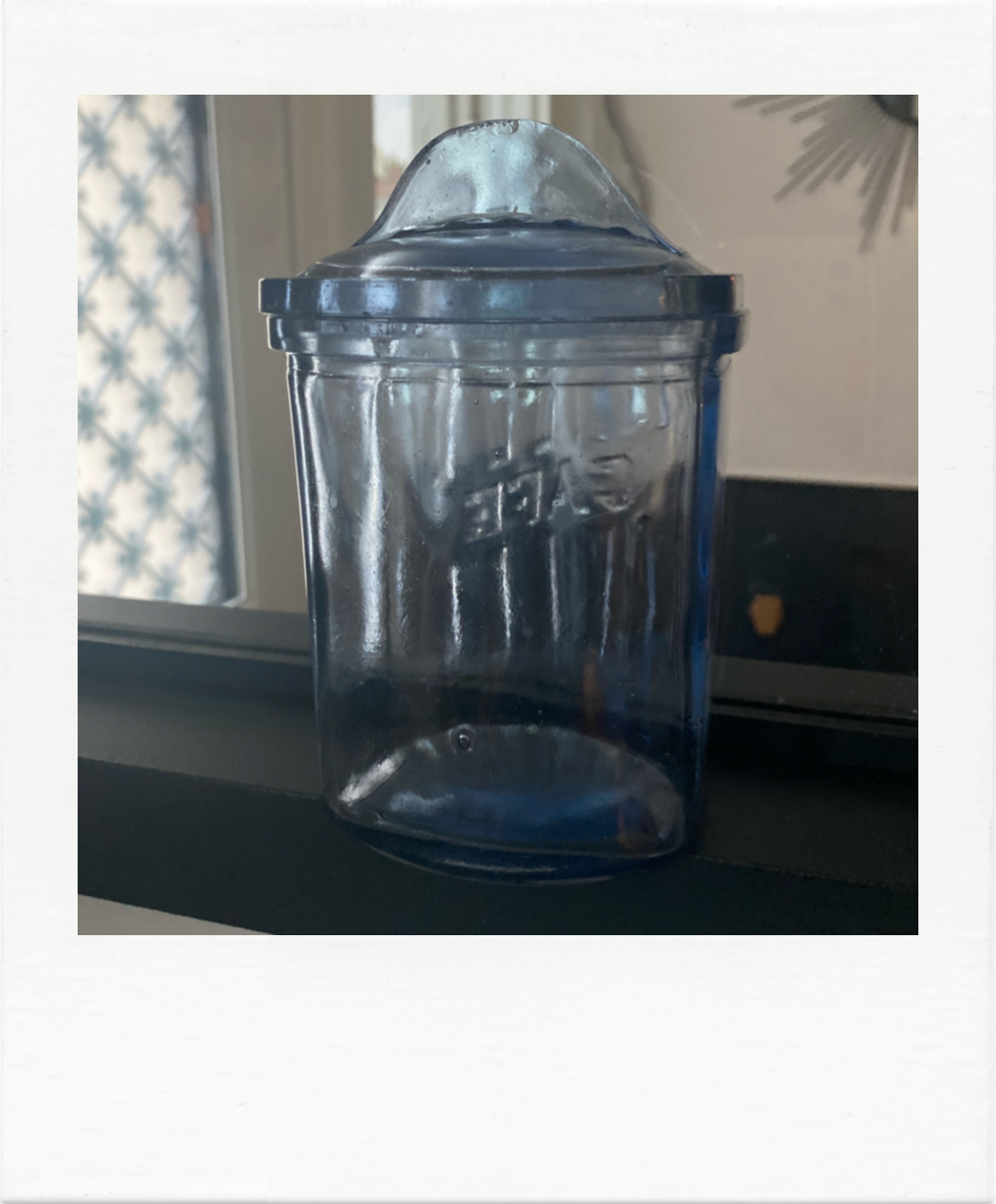 Old coffee pot in blue glass