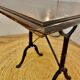 Wrought iron foot bistro table and wooden tray