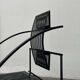 Postmodern black Quinta chair in perforated metal by Mario Botta for Alias, 1980s.