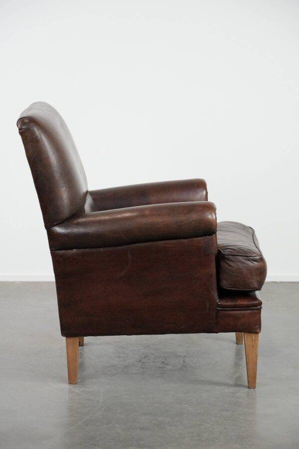 Characterful sheep leather armchair with a beautiful deep colour