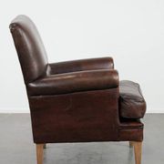 Characterful sheep leather armchair with a beautiful deep colour