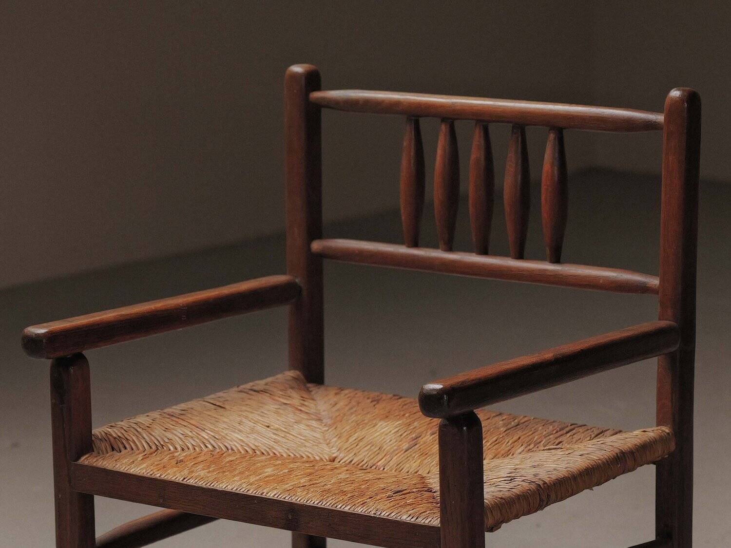Wicker armchair in solid wood, handcrafted, France, around 1950.