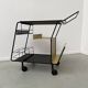 Perforated metal serving trolley in the Mathieu Matégot style