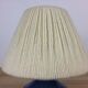 Blue ceramic lamp foot and white wool lampshade