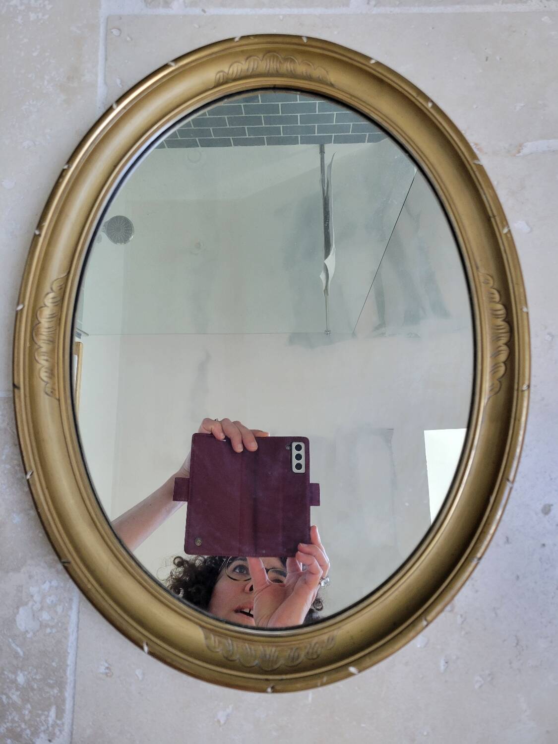 Oval mirror in gilded stucco 45 cm