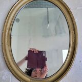 Oval mirror in gilded stucco 45 cm