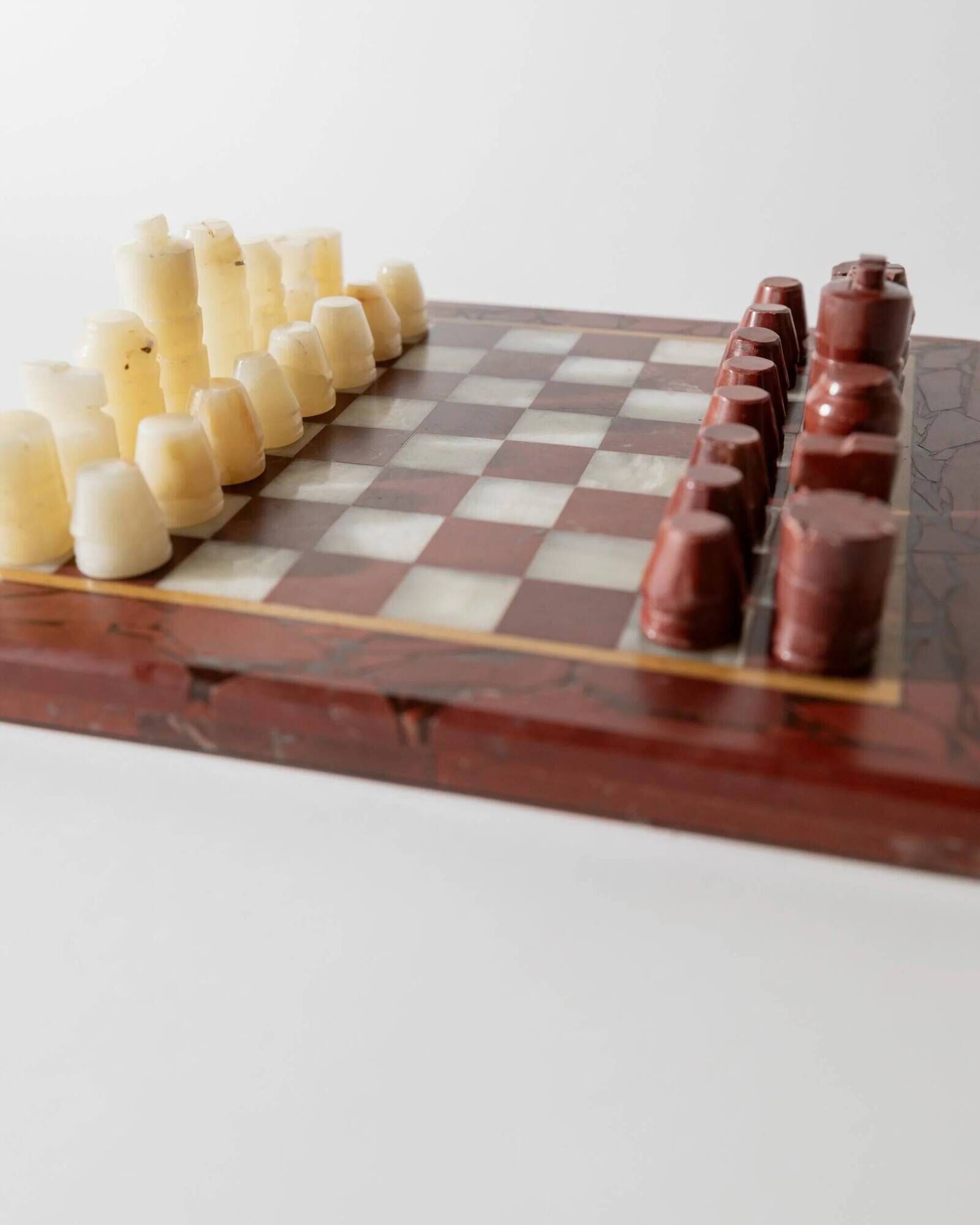 Vintage marble chess set from the 1960s, cream, burgundy and gold board with metal inlay, stone pieces.