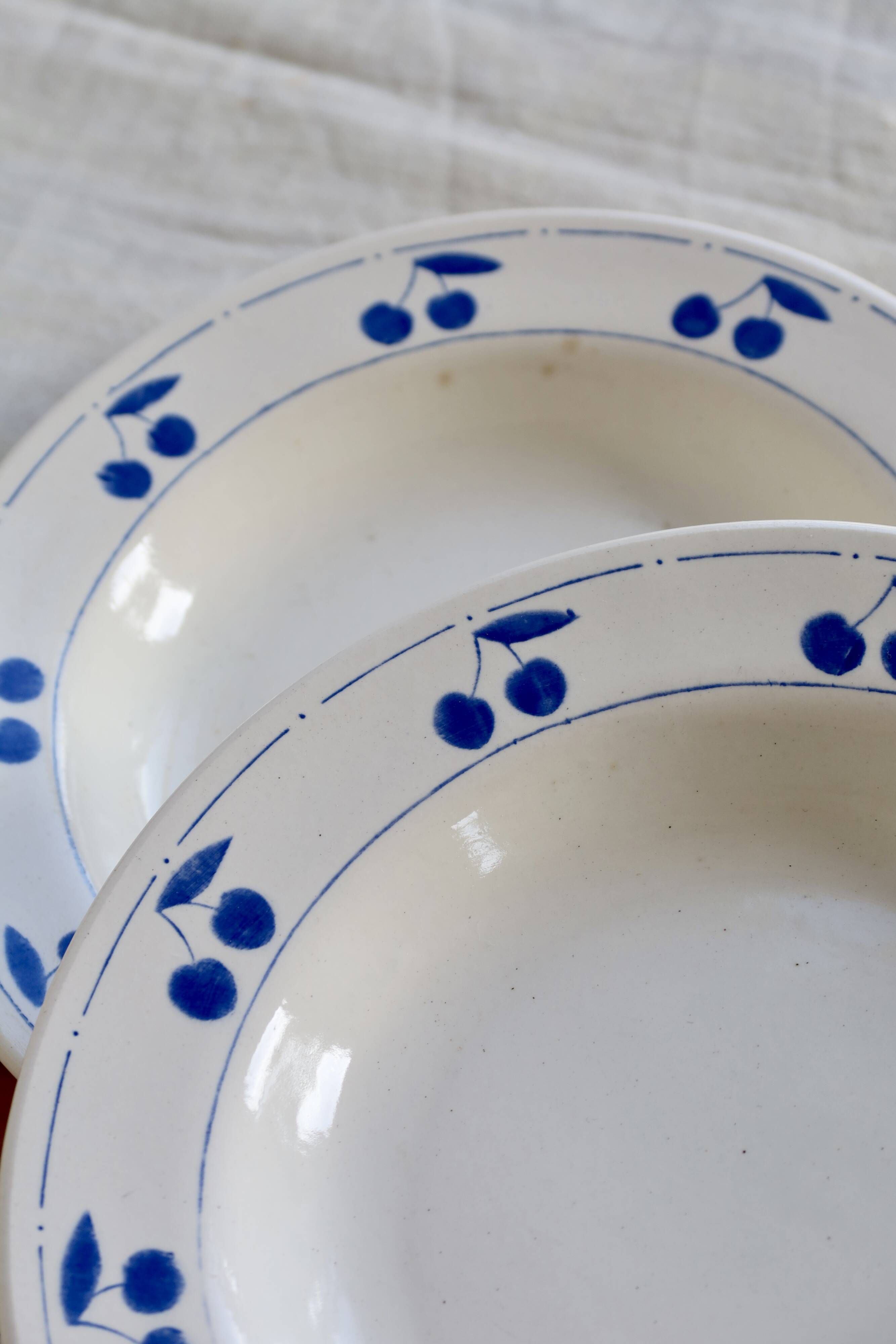 4 vintage deep plates in ivory earthenware with blue cherries