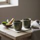 A pair of artisanal cups in traditional kintsugi.